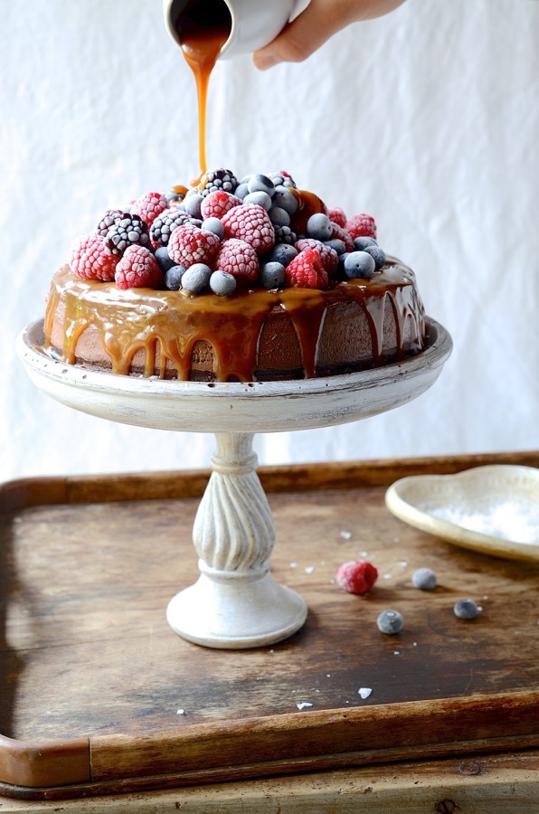 Chocolate cheesecake with salted caramel and frosted berries